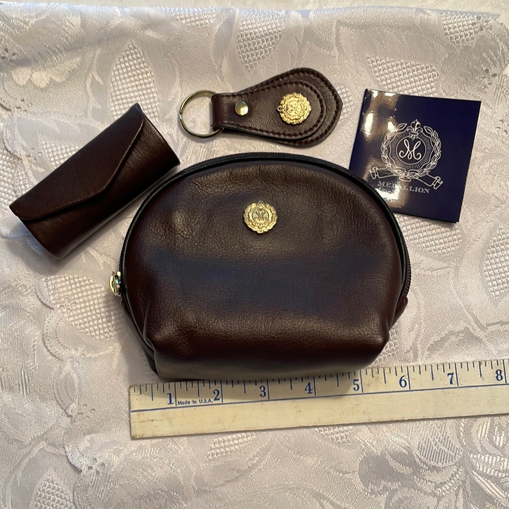 Medallion new brown leather small clutch